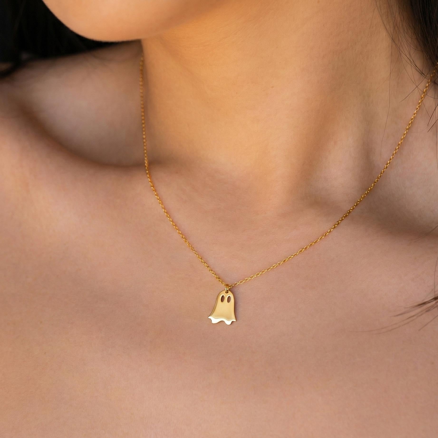 Minimalist gold ghost necklace pendant on a model, cute spooky mama jewelry gift for mothers day, dainty charm necklace aesthetic