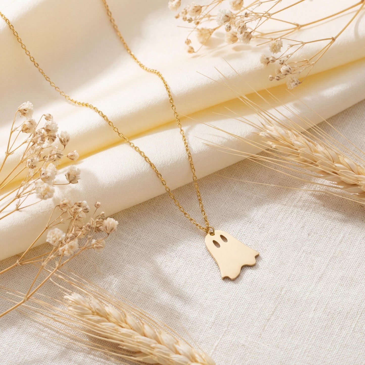 Minimalist gold ghost necklace pendant on a model, cute spooky mama jewelry gift for mothers day, dainty charm necklace aesthetic
