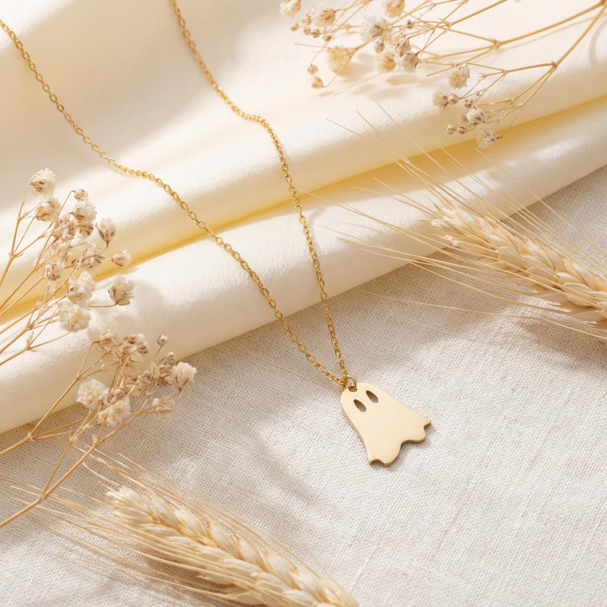 Minimalist gold ghost necklace pendant on a model, cute spooky mama jewelry gift for mothers day, dainty charm necklace aesthetic