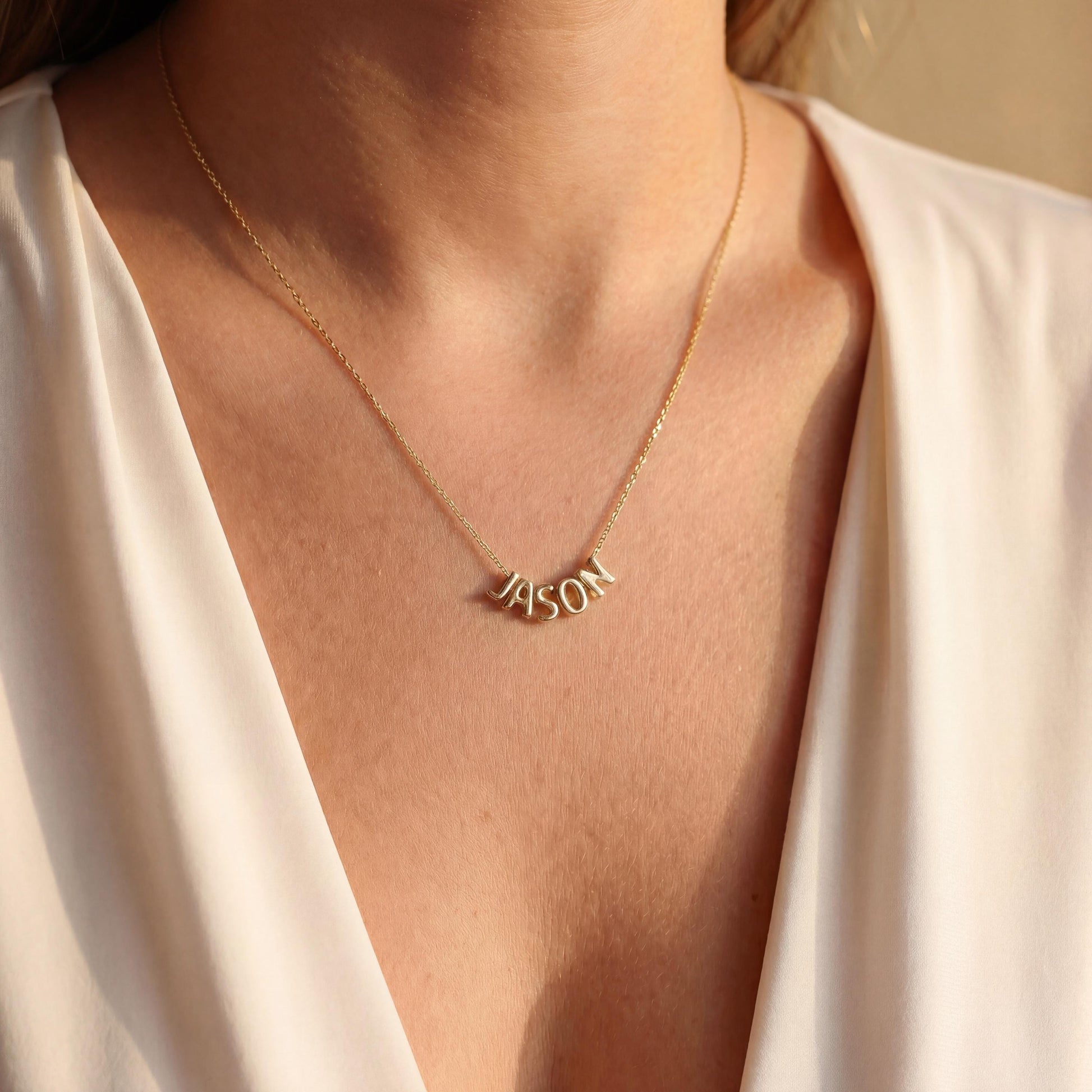 Dainty custom name necklace, elegantly worn by a woman, perfect personalized minimalist jewelry gift for Mother's Day