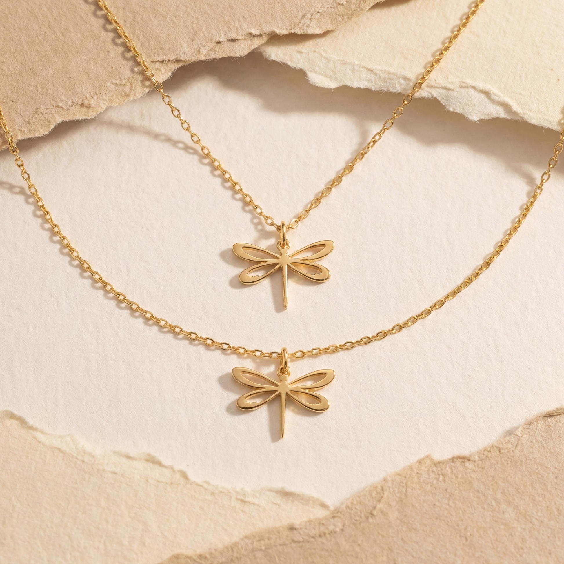 Minimalist 14K gold plated dragonfly necklace worn by a blonde woman, delicate insect pendant resting on collarbone, elegant Mother's Day jewelry gift idea.