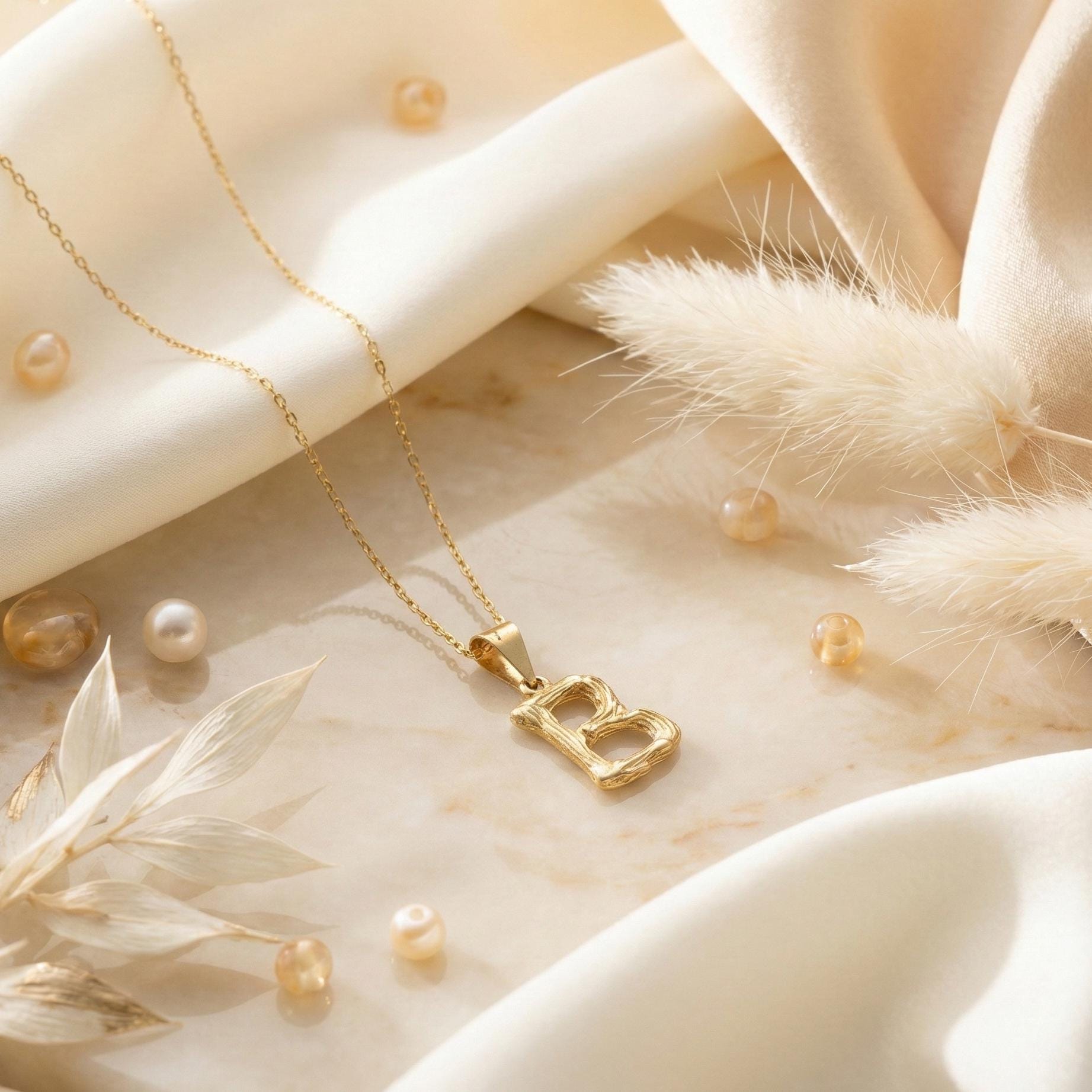 Gold color bamboo texture initial necklace letter pendant on model, minimalist personalized jewelry for mothers day gift.