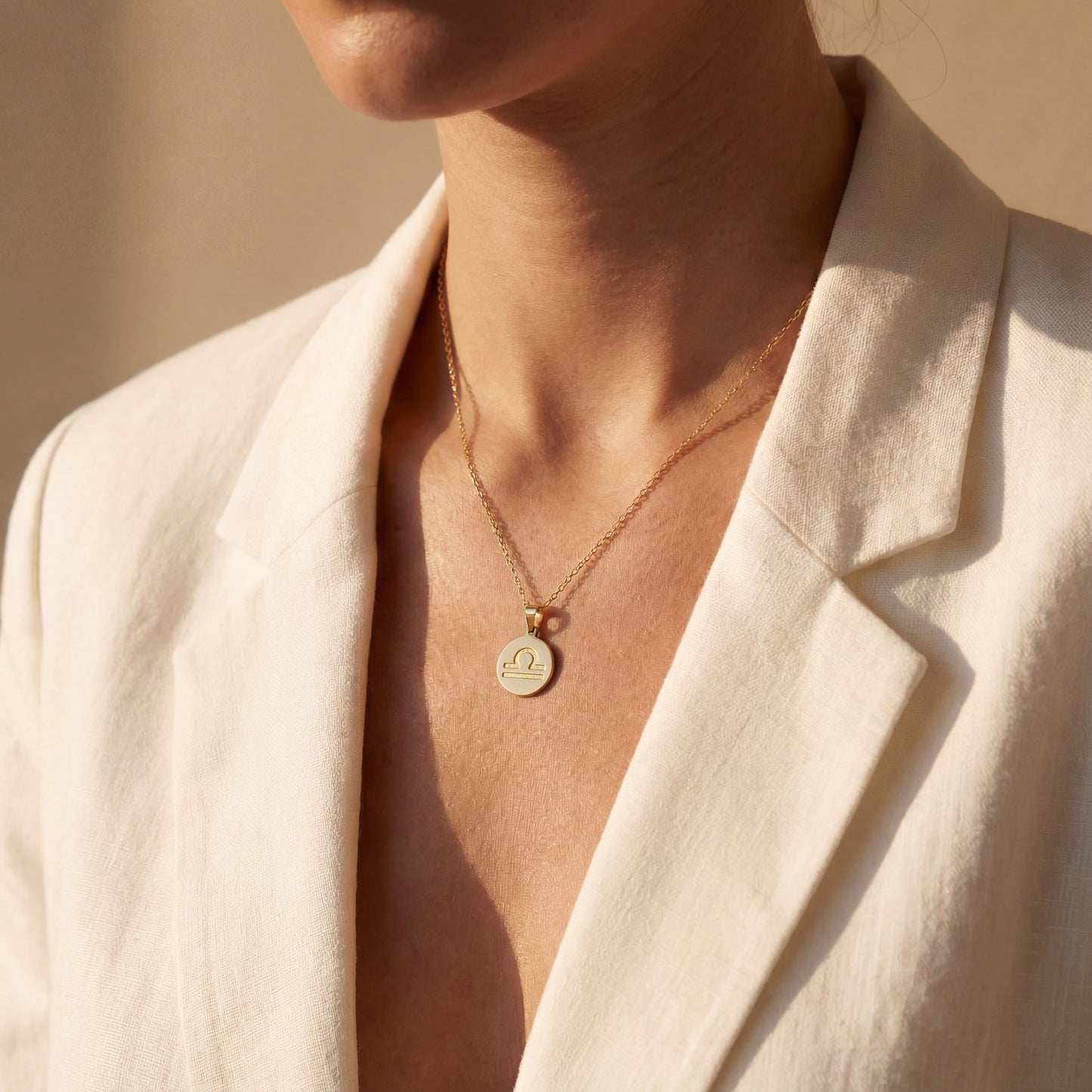 Minimalist round Libra zodiac coin necklace on model, dainty astrology pendant gift for September and October birthdays, celestial jewelry style