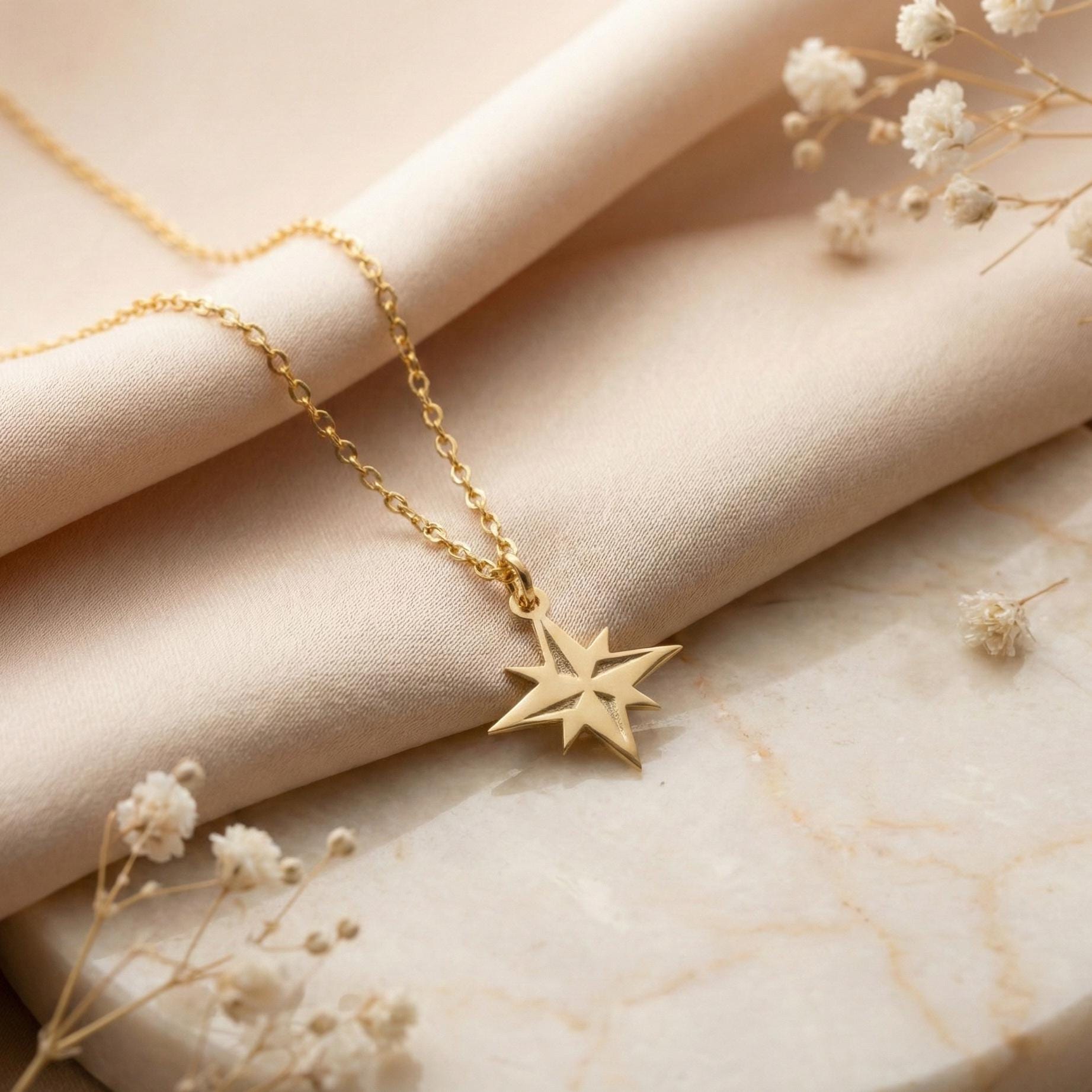 Gold North Star necklace on model, minimalist celestial jewelry pendant, eight-pointed starburst charm necklace, dainty layering necklace gift for her, mothers day and graduation jewelry gift idea