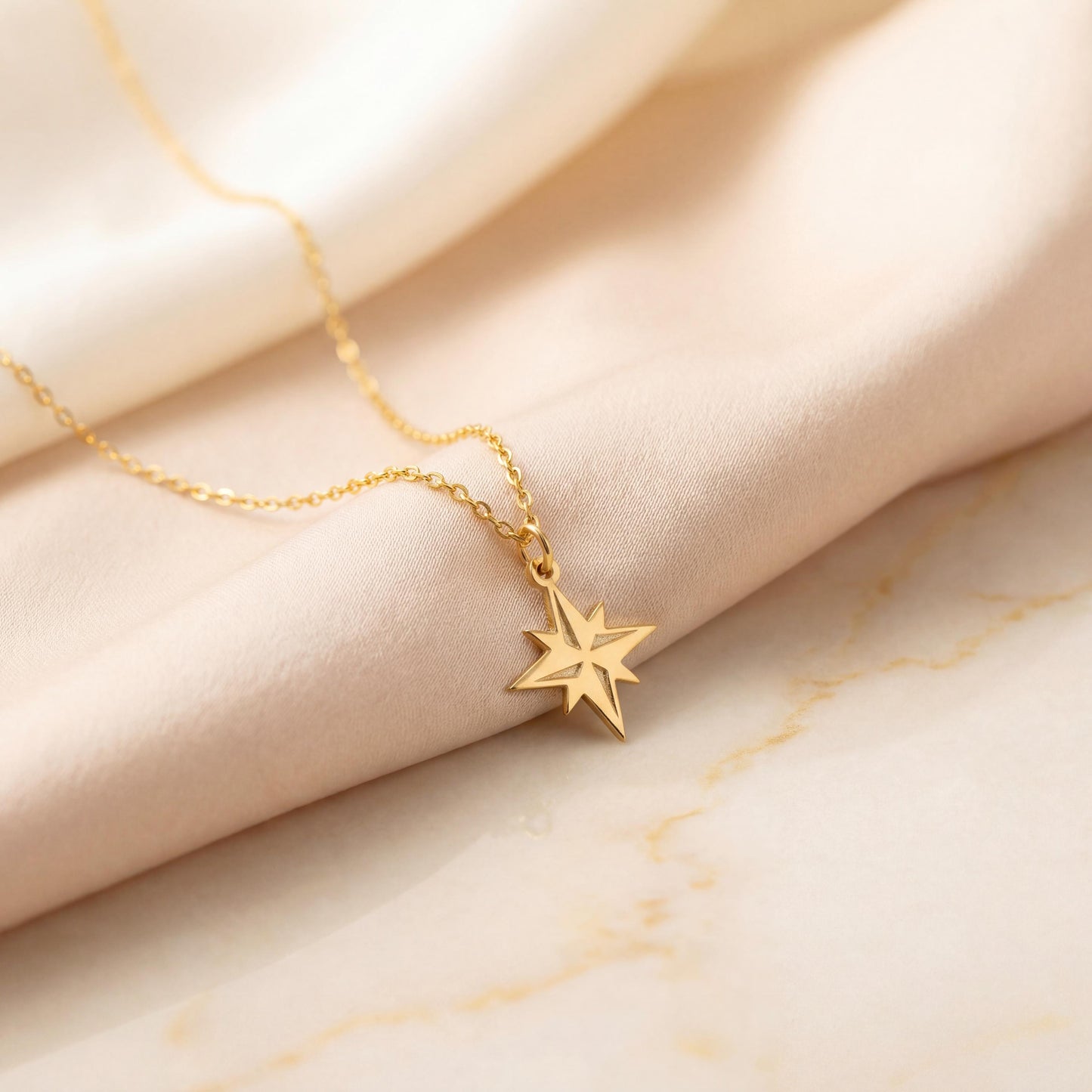 Gold North Star necklace on model, minimalist celestial jewelry pendant, eight-pointed starburst charm necklace, dainty layering necklace gift for her, mothers day and graduation jewelry gift idea