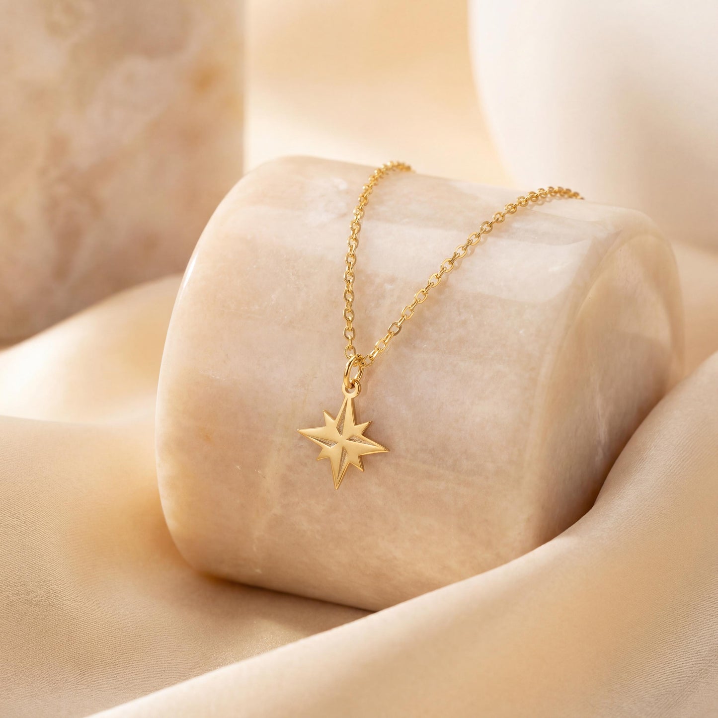 Gold North Star necklace on model, minimalist celestial jewelry pendant, eight-pointed starburst charm necklace, dainty layering necklace gift for her, mothers day and graduation jewelry gift idea
