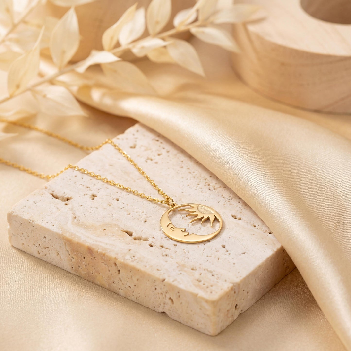 14K gold plated dainty sun and crescent moon face pendant necklace worn by a woman, celestial minimalist boho jewelry.